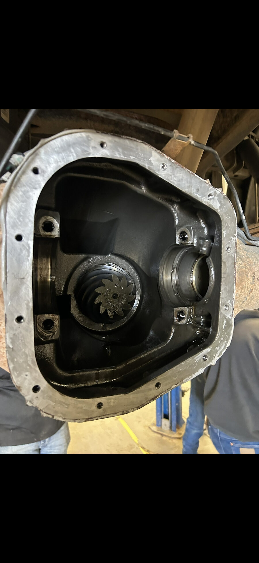 Close-up of a differential being repaired